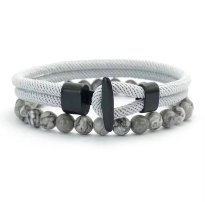 Double layer stone bracelet by GIORGIO MARENO featuring smooth stones and adjustable clasp on a neutral background.